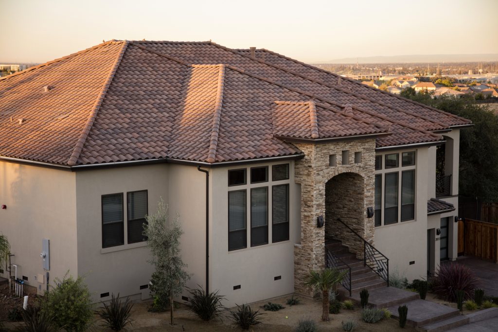 Eagle Roofing photograph of a home with a warm-toned tile roof — not a Westmark project